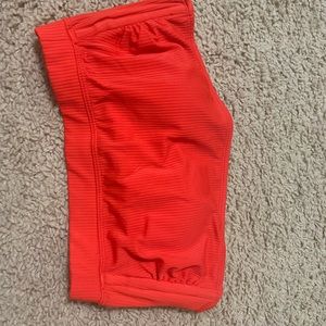 Red bando bathing suit top with straps.